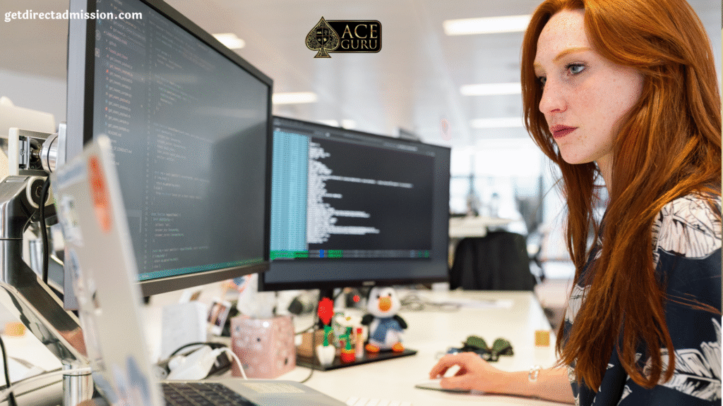 a woman sitting at a desk with a computer