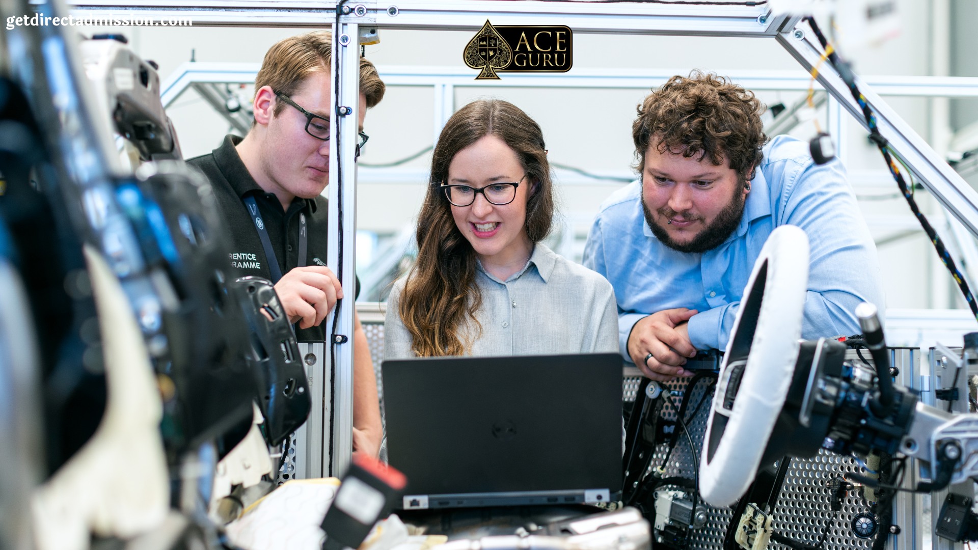 a group of people looking at a laptop