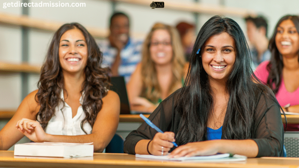 a group of women sitting at desks smiling
